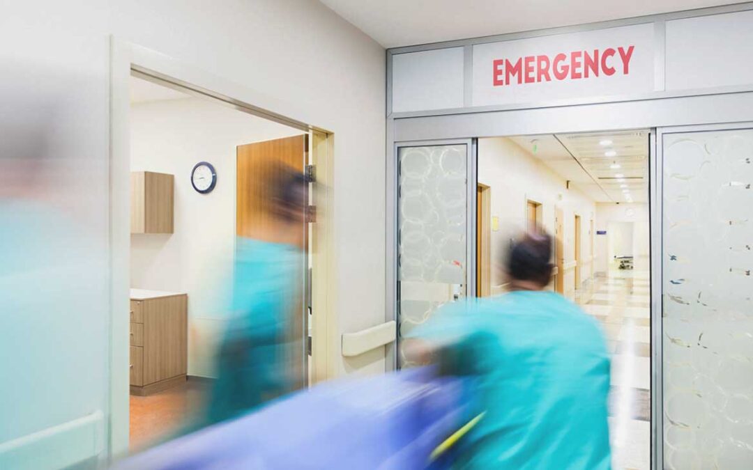 A triage nurse assessing a patient in an emergency department